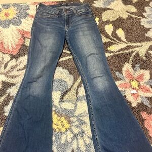 Hollister size 25 petite low rise flare jeans with a raw hem